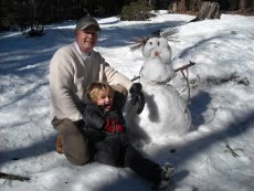 Adoptive Family Photo: Drake and His Papa Building a Snowman, click to view bigger version