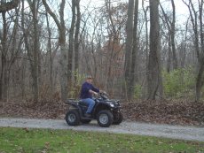 Adoptive Family Photo: Bill Riding the Four-Wheeler, click to view bigger version