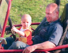 Adoptive Family Photo: Barry and Jack Love to Dune <br>Buggy, click to view bigger version