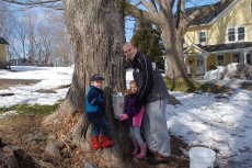 Adoptive Family Photo: With Alex and Zach Collecting Sap at a Community Farm