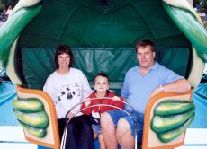 Adoptive Family Photo: Having a Blast on the Amusement Rides, click to view bigger version