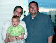 Adoptive Family Photo: Mom, Leo and Dad, click to view bigger version