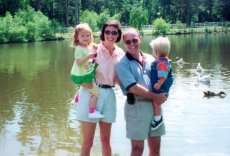 Adoptive Family Photo: With Our Niece and Nephew at a <br>Graduation Party, click to view bigger version