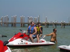 Adoptive Family Photo: Keith and Our Nephew Riding a Jetski, click to view bigger version