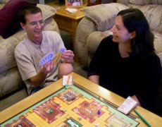 Adoptive Family Photo: Playing Clue in Our Family Room, click to view bigger version