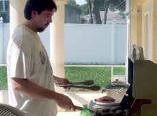 Adoptive Family Photo: Troy Cooking on the Grill for a <br>Birthday Party, click to view bigger version