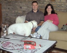 Adoptive Family Photo: Working on a Puzzle with Our Puppies, click to view bigger version