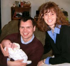 Adoptive Family Photo: Holding Caroline for <br>the First Time, click to view bigger version