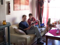 Adoptive Family Photo: Reading/Relaxing in Our Living Room, click to view bigger version