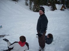 Adoptive Family Photo: Brian Sledding with His Nephews, click to view bigger version