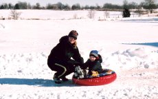 Adoptive Family Photo: Nancy and John Snow Tubing<br>at Our Home, click to view bigger version