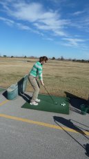 Adoptive Family Photo: Kelly Practicing Her Golf Swing, click to view bigger version