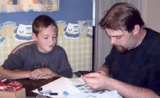 Adoptive Family Photo: Jared and Nathan<br>Putting Together a Model Car, click to view bigger version