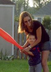 Adoptive Family Photo: Krissy Helping Her Nephew <br>Play Baseball, click to view bigger version