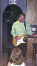 Adoptive Family Photo: Eric Plays Guitar for His Niece, click to view bigger version