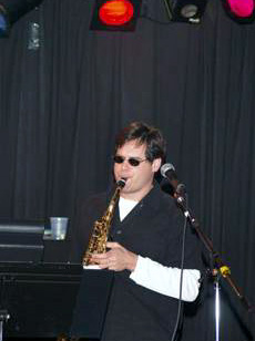 Adoptive Family Photo: Don Plays Saxophone with<br> His Band, click to view bigger version
