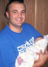 Adoptive Family Photo: Jay Holding His Best<br>Friend�s Baby, click to view bigger version