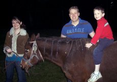 Adoptive Family Photo: Giving Rides on the Family�s Horse, click to view bigger version