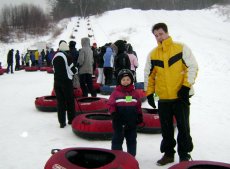 Adoptive Family Photo: Alexander and Peter Having Fun Snow Tubing, click to view bigger version