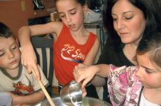 Adoptive Family Photo: Laura Baking Cookies with Her Nieces<br> and Nephew, click to view bigger version