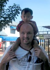 Adoptive Family Photo: Parker Taking a Ride on<br>Daddy's Shoulders in Mexico, click to view bigger version