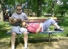 Adoptive Family Photo: Bob Reading to Lisa at the Park, click to view bigger version