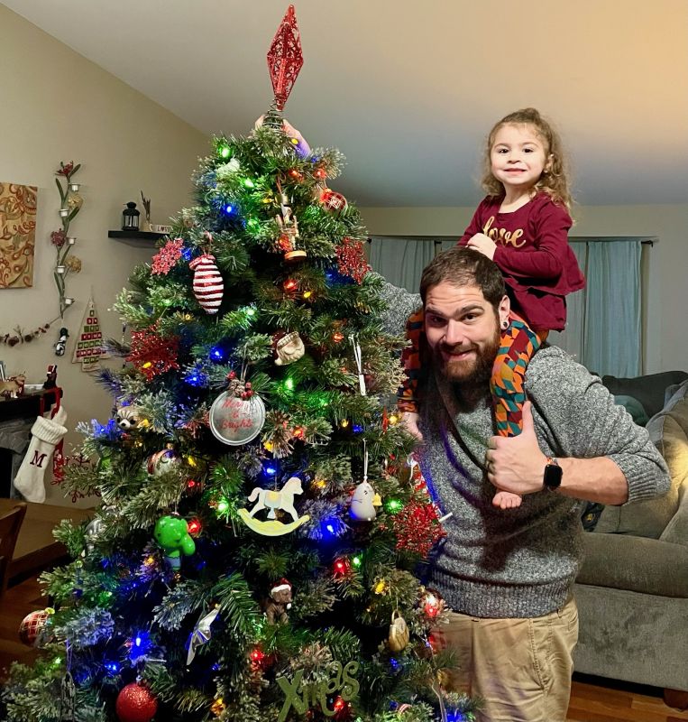 Helping Our Niece Put the Star on Top of the Christmas Tree