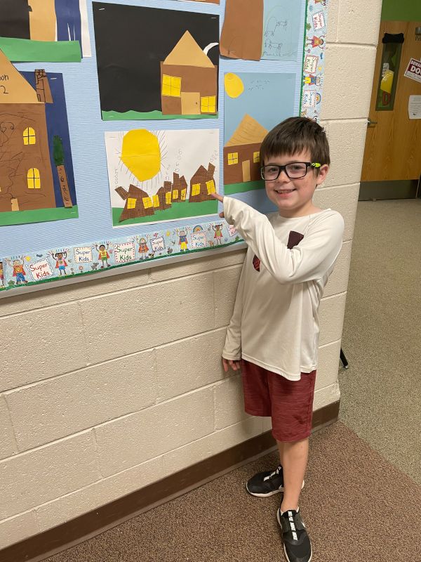 Lincoln Showing Off His Work at School