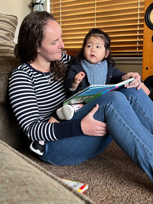 Nicole Reading With a Friend's Child