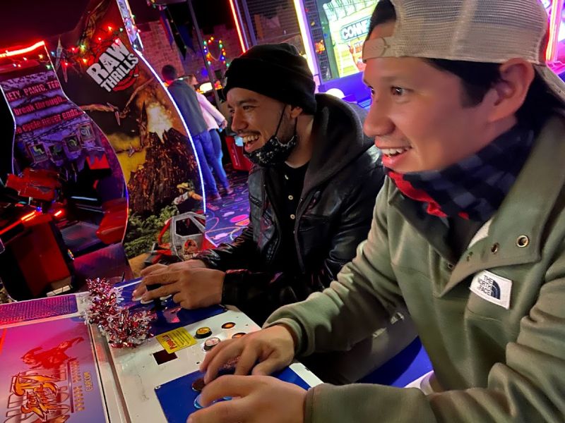 Adrian Playing at an Arcade With Our Friends