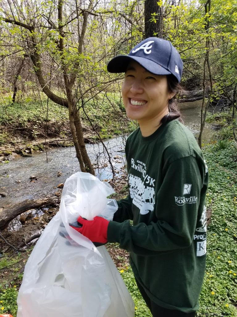 Adrienne Volunteering at a Local Park Clean-Up Event