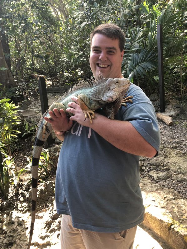 Chad Holding an Iguana in Jamaica