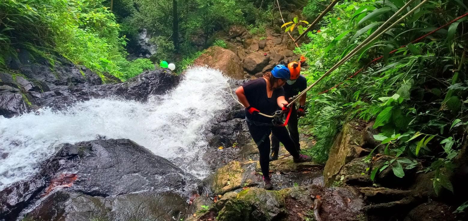 Tracy Repelling Down a Waterfall