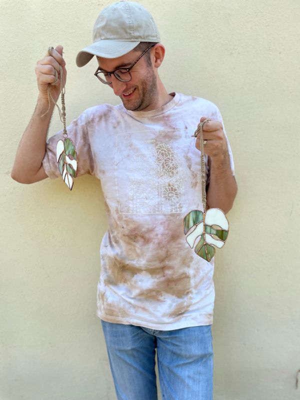 Kevin With Some of His Stained Glass Art Pieces
