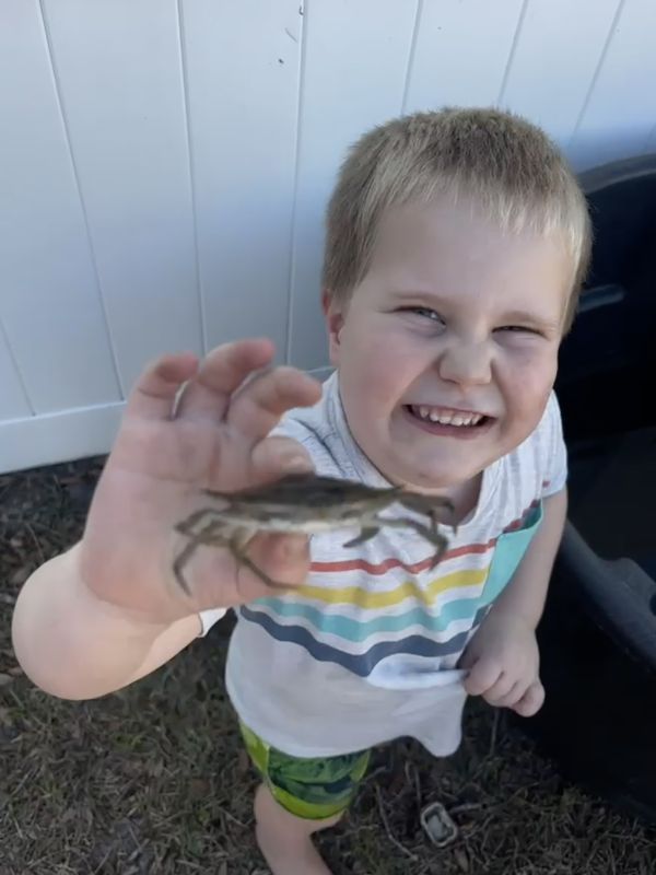 Zeke Showing Off a Blue Crab He Caught