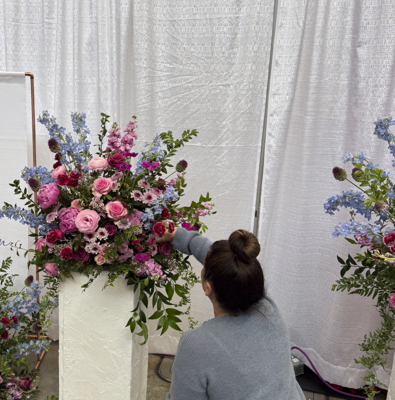 Jenny Designing a Floral Arrangement at a Bridal Show