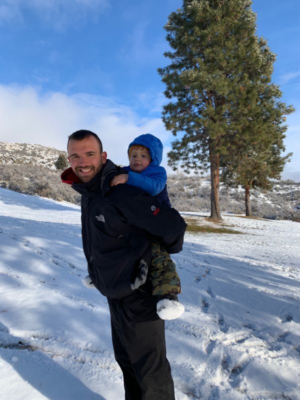Giving Our Nephew a Ride Up the Mountain While Sledding