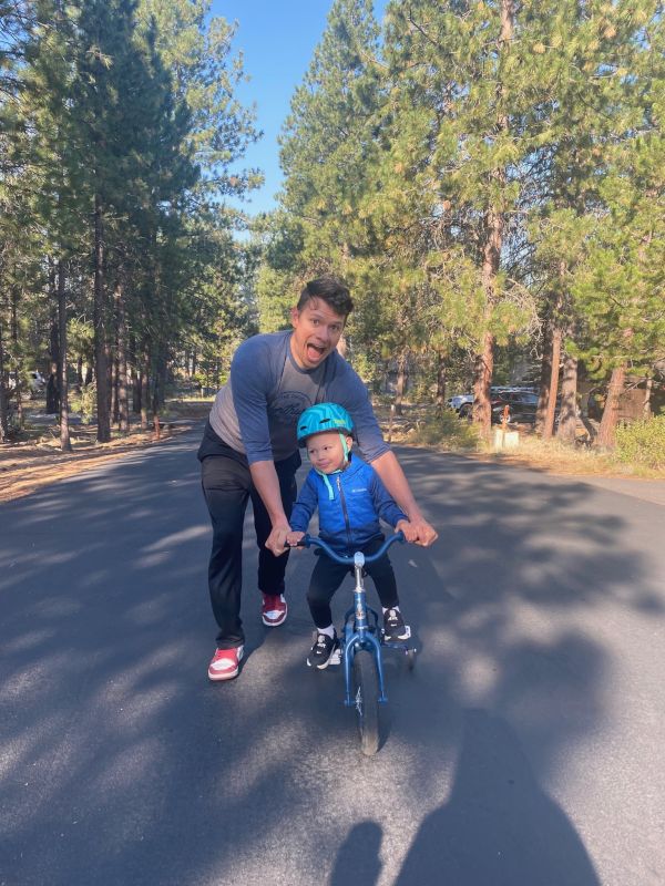 Jared Helping Our Nephew Ride a Bike