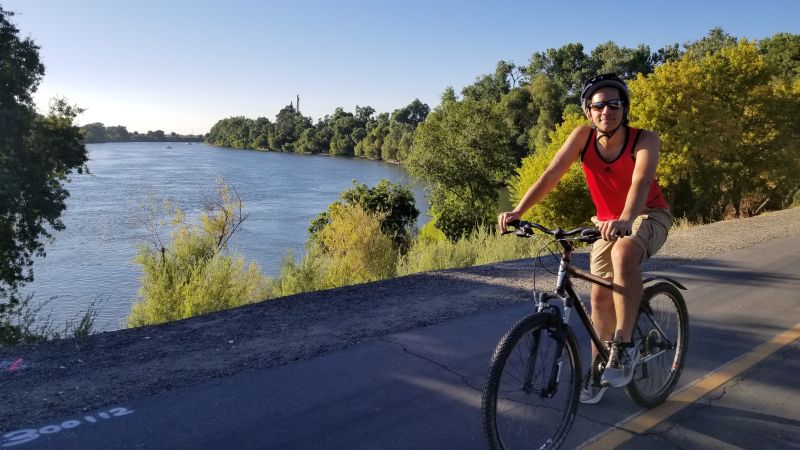 Robby Biking Along the Sacramento River
